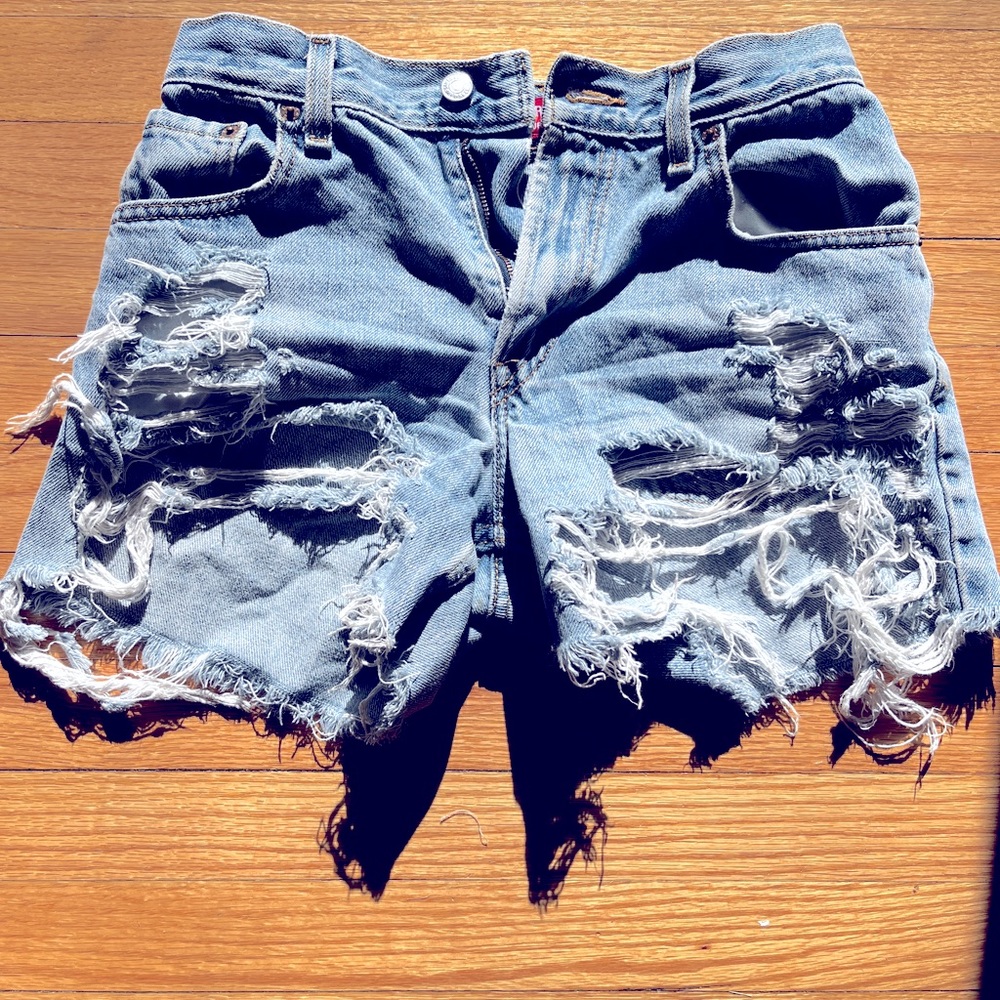 Vintage Levi’s 550 light wash ultra distressed denim high-waisted shorts